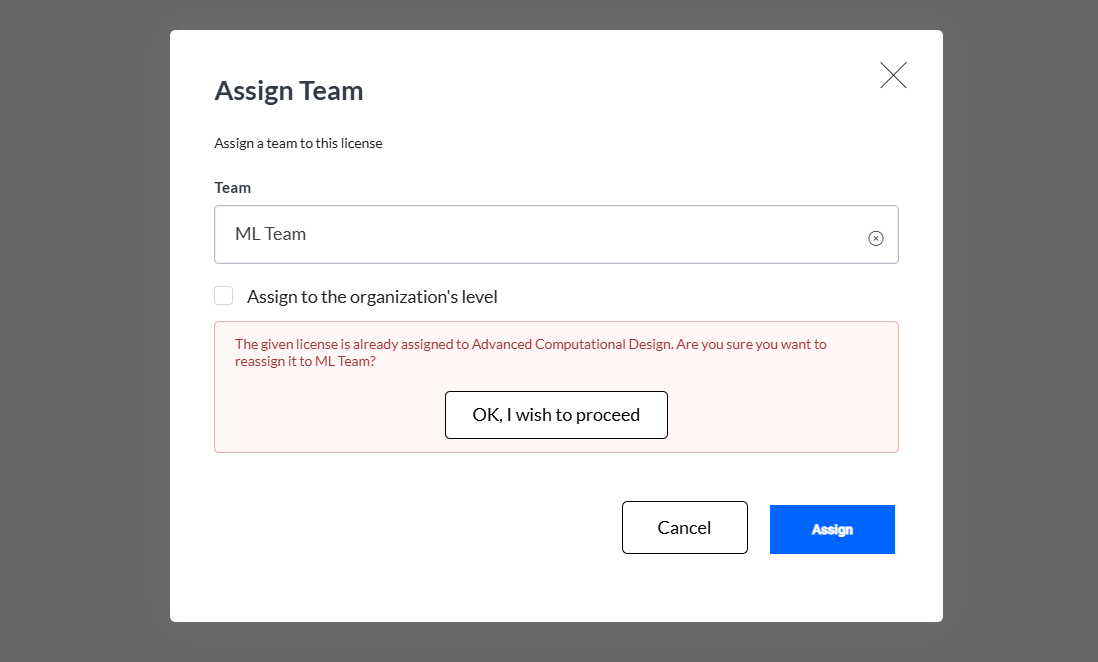 The Assign team window will show a warning message if the license is already assigned to another team.